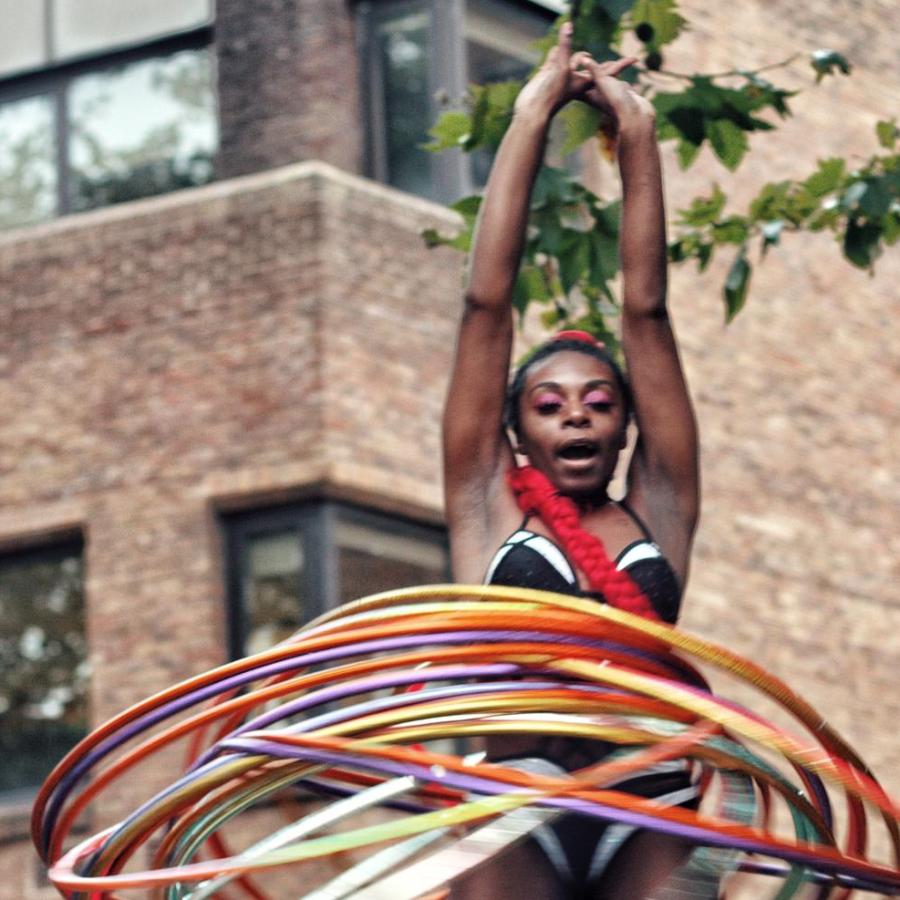A woman hula hoops at Tolmer's Square festival 