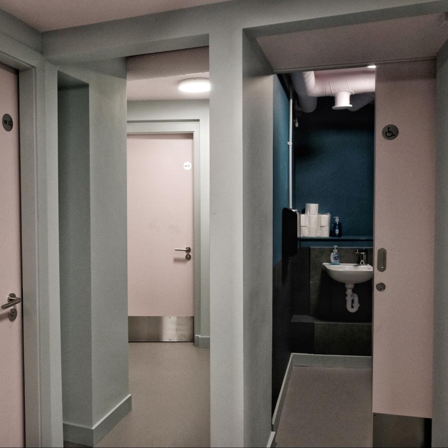 Four gender neutral bathrooms next to the basement rehearsal space 