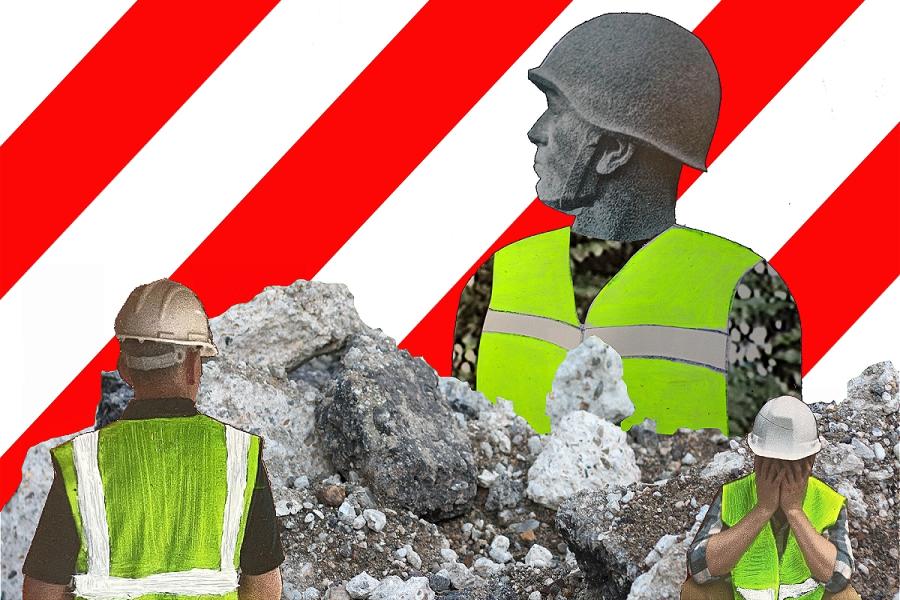 A statue of a huge soldier bust wearing a high viz jacket, emergiubg from a pile of rubble. Two builders in high viz vests in the forground: one with his back to us, the second facing us with his face hidden in his hands.