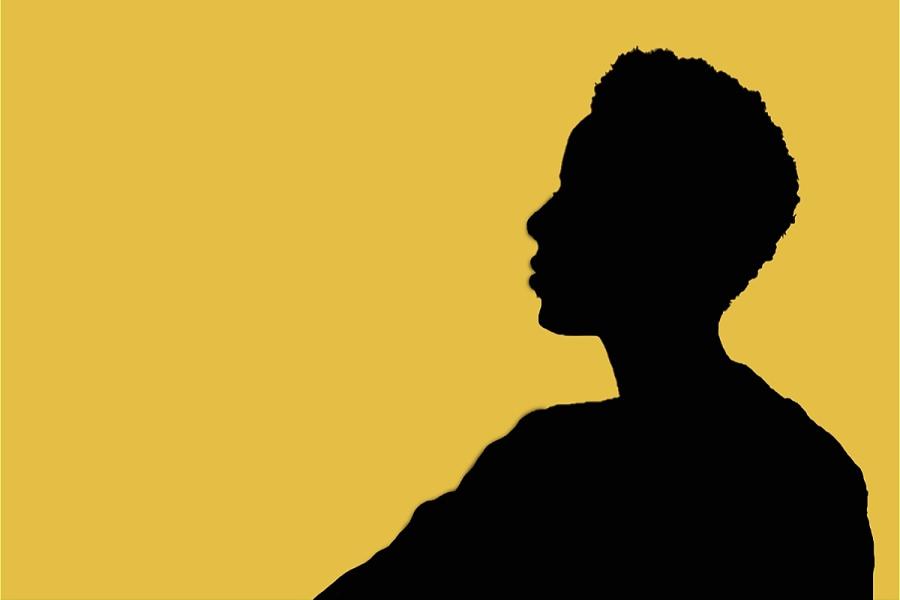 Side profile silhouette of someone, infront of a yellow background