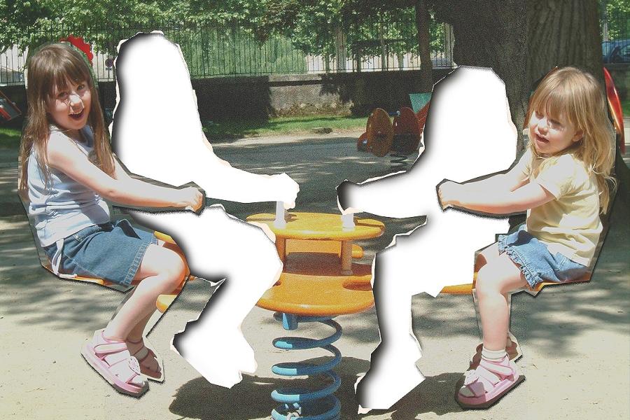 A slightly grainy photo of two young sisters sitting on either end of a see-saw in a park. Each of their figures has been cut out of the picture, leaving tears paper, and stuck nearby to leave a gap where they once were.