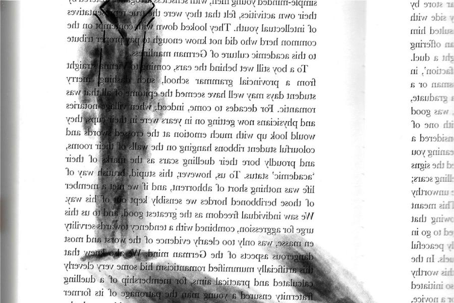 A black and white drawing of a human figure, staring at its' shadow, drawn on a book page.