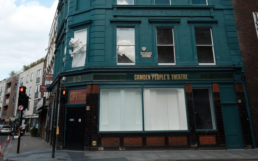The exterior of a teal building with gold lettering that reads Camden People's Theatre.