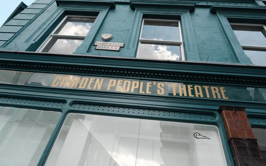 Camden People's Theatre building pictured from the outside with teal walls and big windows.